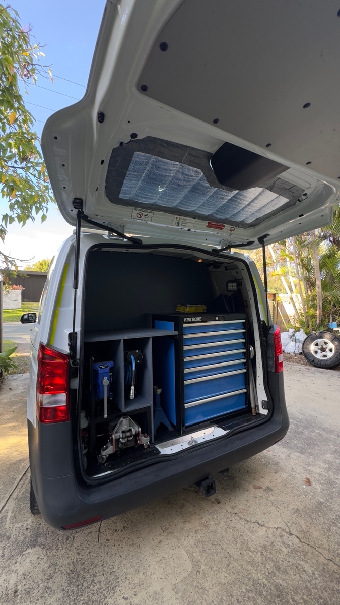 Equipped mobile mechanic van with organised tools and workshop storage